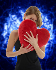 Woman with heart pillow