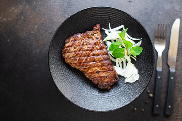 fresh steak beef juicy grilled meat barbecue portion B-B-Q on the table, healthy food meal snack copy space food background rustic. top view keto or paleo diet