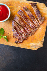 fresh steak beef juicy grilled meat barbecue portion B-B-Q on the table, healthy food meal snack copy space food background rustic. top view keto or paleo diet