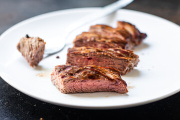 fresh steak beef juicy grilled meat barbecue portion B-B-Q on the table, healthy food meal snack copy space food background rustic. top view keto or paleo diet