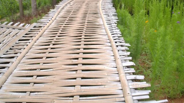 amboo walkway traditional of upcontry famer, wooden rural footpath over the flower farm