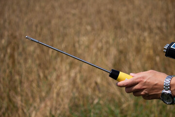 hand holds a noise metering sensor on the wrist watch 