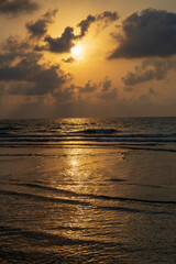Obraz premium A hazy golden sunset before a dust storm in the Mediterranean. Golden background. Israel