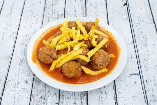 Beef Meatloaf Stewed With Vegetables And Lots Of Sauce For Dipping With Homemade Chips On Top