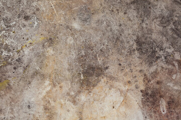 Background image of a grunge texture in gray-brown tones. Abstract background with stains of rust, dirt and paint.