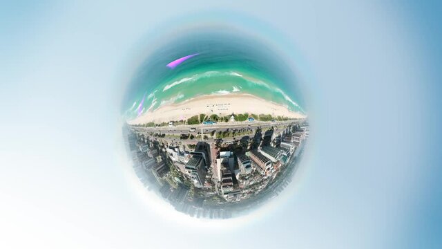 Little Planet aerial from Barra da Tijuca beach, in Rio de Janeiro, Brazil. Turquoise water seen by drone