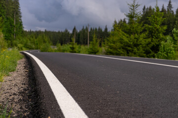 wavy road in the mountains and forest