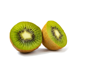 Halves of ripe kiwi on a white background isolate