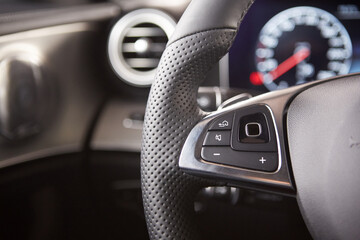 Obraz na płótnie Canvas Control buttons on the steering wheel of a car