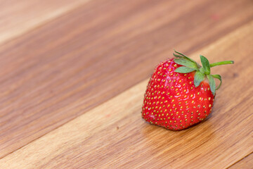 Fresh strawberry on wooden background. Fresh, red and tasty