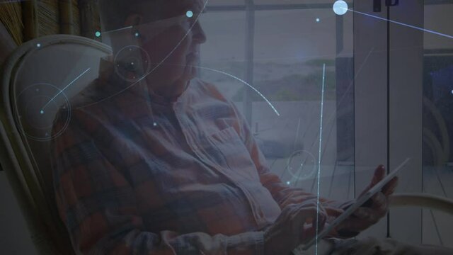 Animation of networks of connections with icons over man using tablet