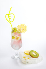 Fruit cold drink with ice on a white background. Refreshing cocktail
