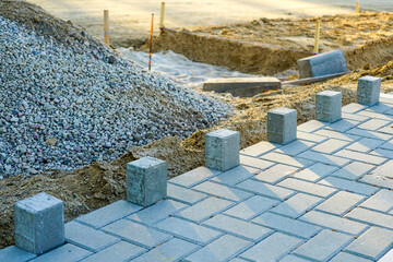 view of the pavement construction site, concrete tiles and the prepared gravel base