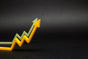 An uptrend, increased sales, or increased value. graphic arrows pointing upwards on black...