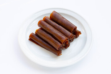 Dried mango paste on white background.