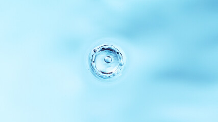 Macro shot of dripping water drop.
