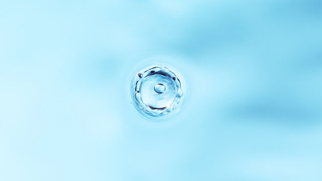 Macro shot of dripping water drop.