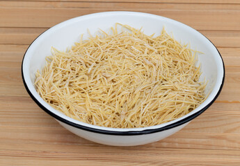 Closeup shot of homemade noodles in a table