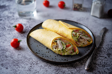 Corn tortilla with chicken and vegetables in a plate