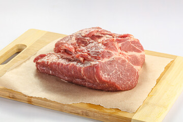 Raw pork neck over board