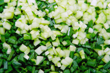 Fresh cucumber finely chopped for cooking salads