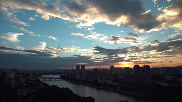 A day to night time-lapse of dark clouds flowing in the sky over the city in China 