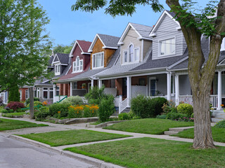 Residential street with small semi-detached houses with gable dormer windows