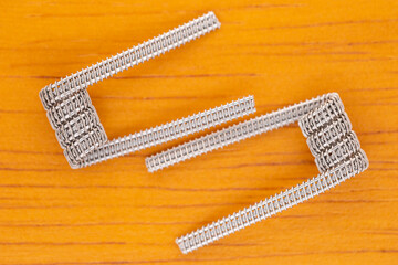 close up, closeup, macro shot of prebuilt framed staple fused clapton coils, fancy coil, art coil...