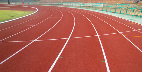 Fototapeta premium Red running track in stadium.