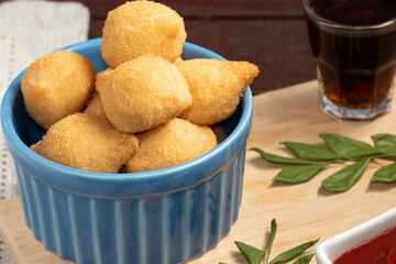 Portion of Brazilian snack coxinha of chicken, close up.