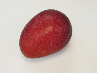 Okinawa,Japan - June 30, 2021: Isolated ripe apple mango on white background
