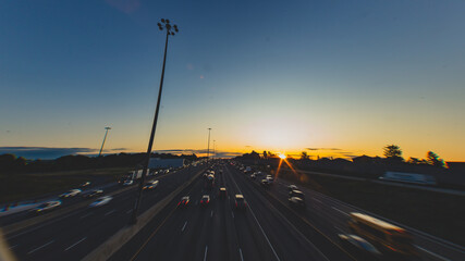 Long exposure shot of cars commuting in the morning on a highway in Toronto, Canada.