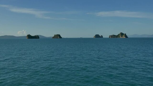 Passing by the Five islands west of Koh Samu island in aouthern  Thailand - taken from deck of moving boat