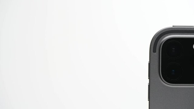 Close up of sensor and two cameras lens on new model of flagship tablet with wifi isolated on white background.