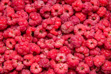 Top view of raspberries as textured background. Ripe red raspberries.