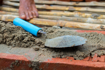 Naklejka premium selective focus of bricks ballast work.