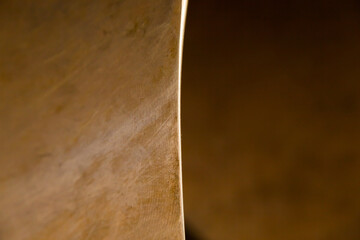 Part of the bronze ship propeller, closeup. Abstract, scratched, bronze texture.