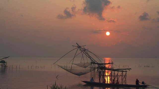 Fisherman's way of life in the morning with catching fish giant yor at Parkpra Phatthalung, Thailand