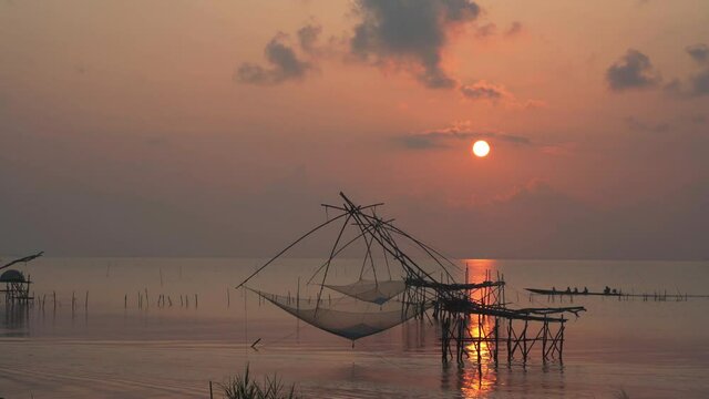 Fisherman's way of life in the morning with catching fish giant yor at Parkpra Phatthalung, Thailand