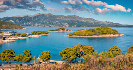 Breathtaking seascape of Ionian sea with Corfu island on background. Gorgeous spring view of Ksamil village. Beautiful outdoor scene of Albania, Europe. Traveling concept background.