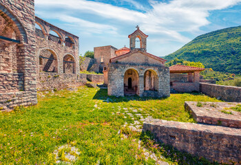 Fototapeta na wymiar Attractive morning view of abandoned St. Mary Monastery among fresh green forest. Splendid spring scene of Albania, Europe. Traveling concept background.