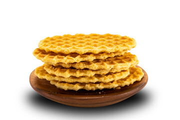 Stack of sweet homemade crispy waffles in a wooden plate on white background.