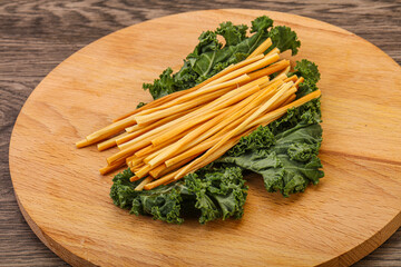 Chechel cheese sticks over board