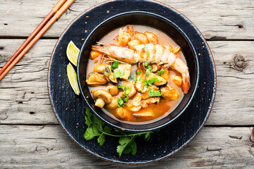 Tom yum soup with seafood and coconut milk