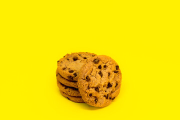 Stacked cookies with yellow background.