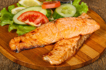 Grilled salmon served vegetables and lemon