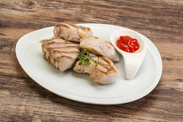 Grilled pork tenderlion with tomato sauce