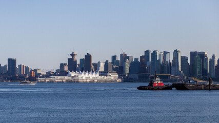 Fototapeta premium The view from Waterfront Park in North Vancouver, looking at the Vancouver Canada Place Sails across the Burrard Inlet