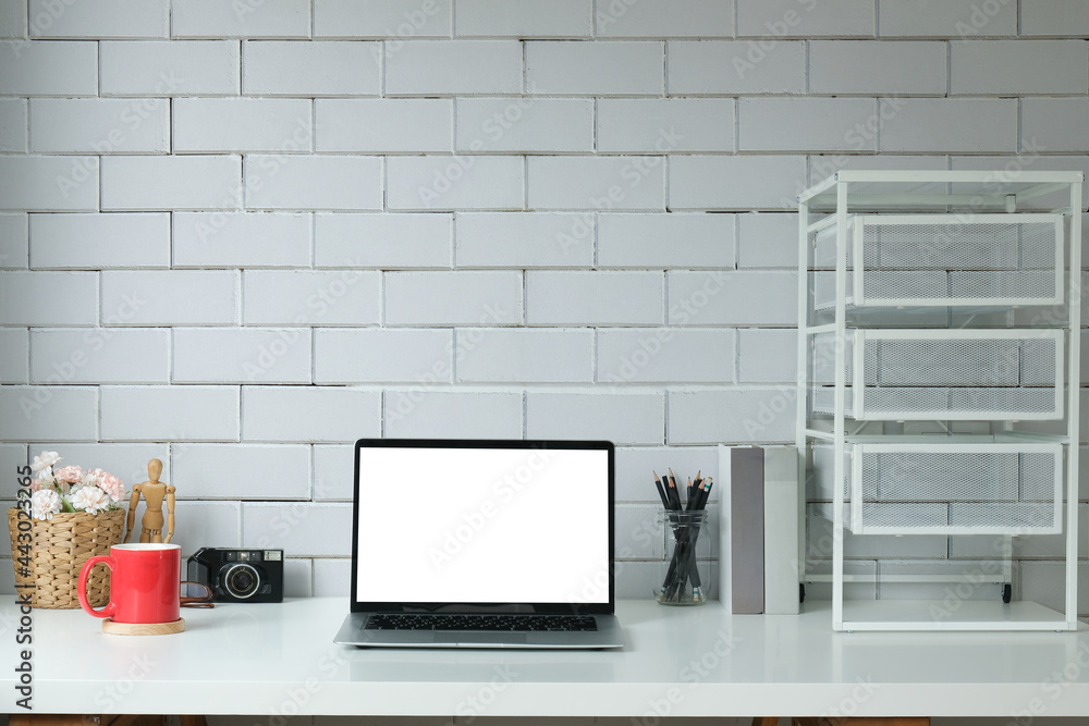 Wall mural Modern workspace with computer with blank screen and equipment on white table.Blank screen for your information.