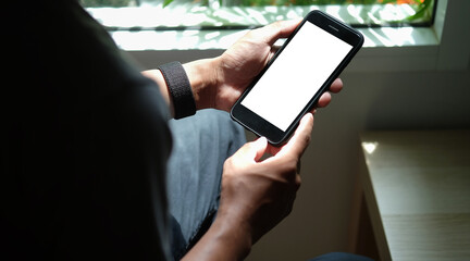 Close up view of business holding mobile phone with blank screen..